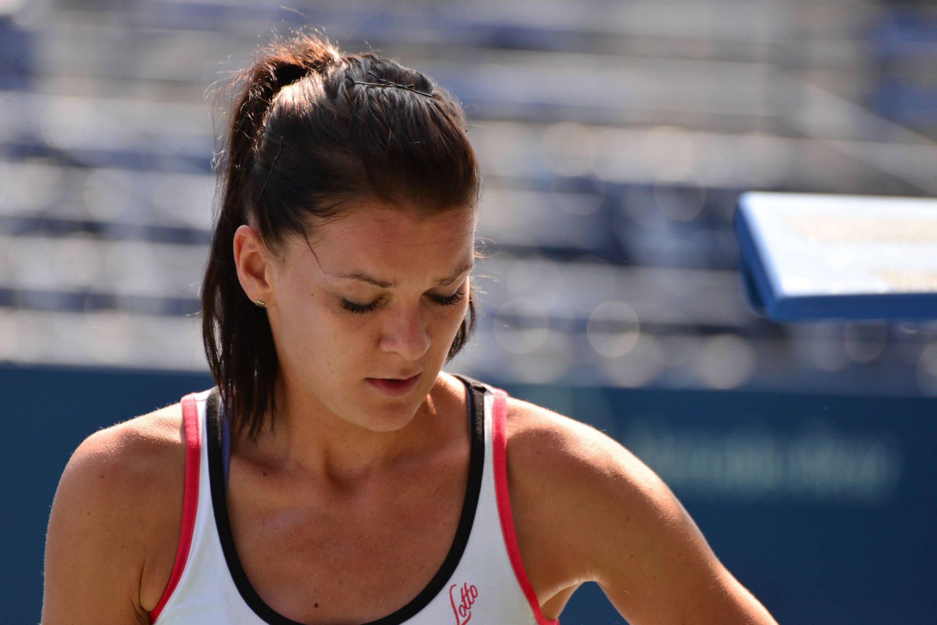 Agnieszka Radwanska in deep thought on the tennis court Wallpaper