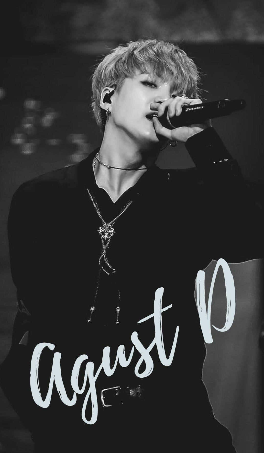Agust D in action – The powerful music sensation Wallpaper