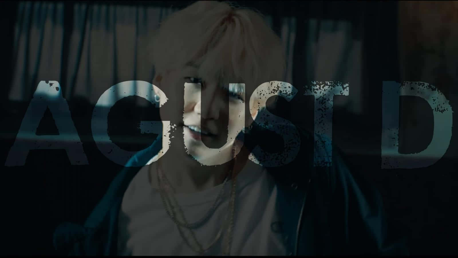 Agust D Smiling for a Photoshoot in a Stylish Outfit Wallpaper
