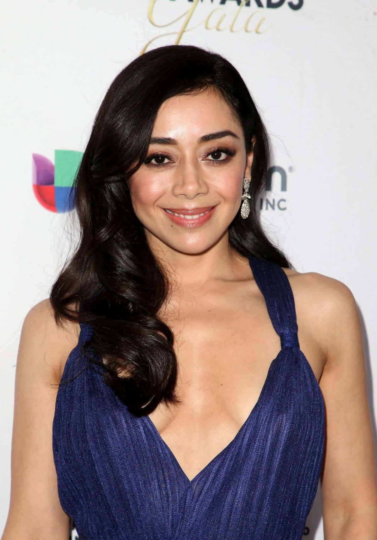 Aimee Garcia posing elegantly in a stylish outfit Wallpaper