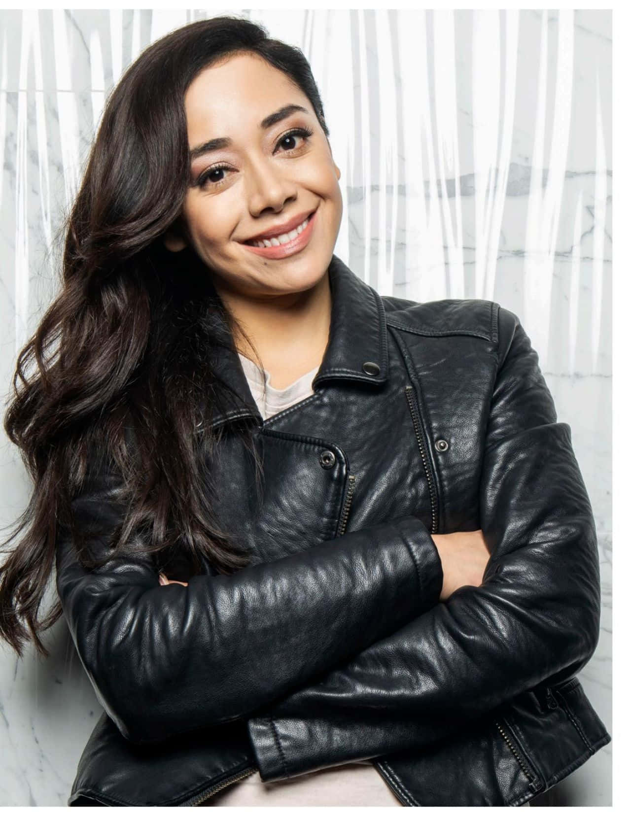 Aimee Garcia smiles charmingly in a casual outfit. Wallpaper