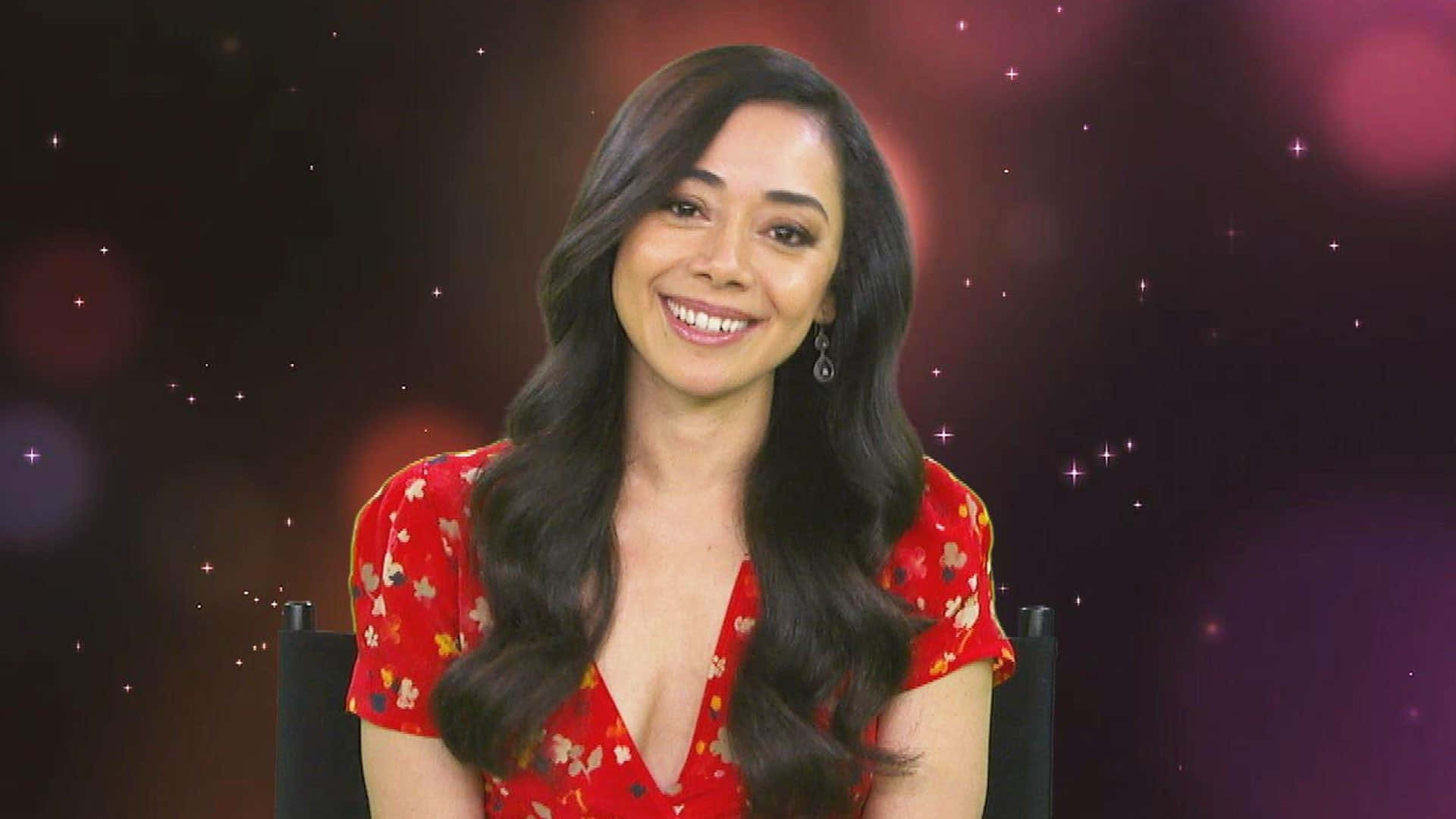 Aimee Garcia radiantly posing on the red carpet Wallpaper