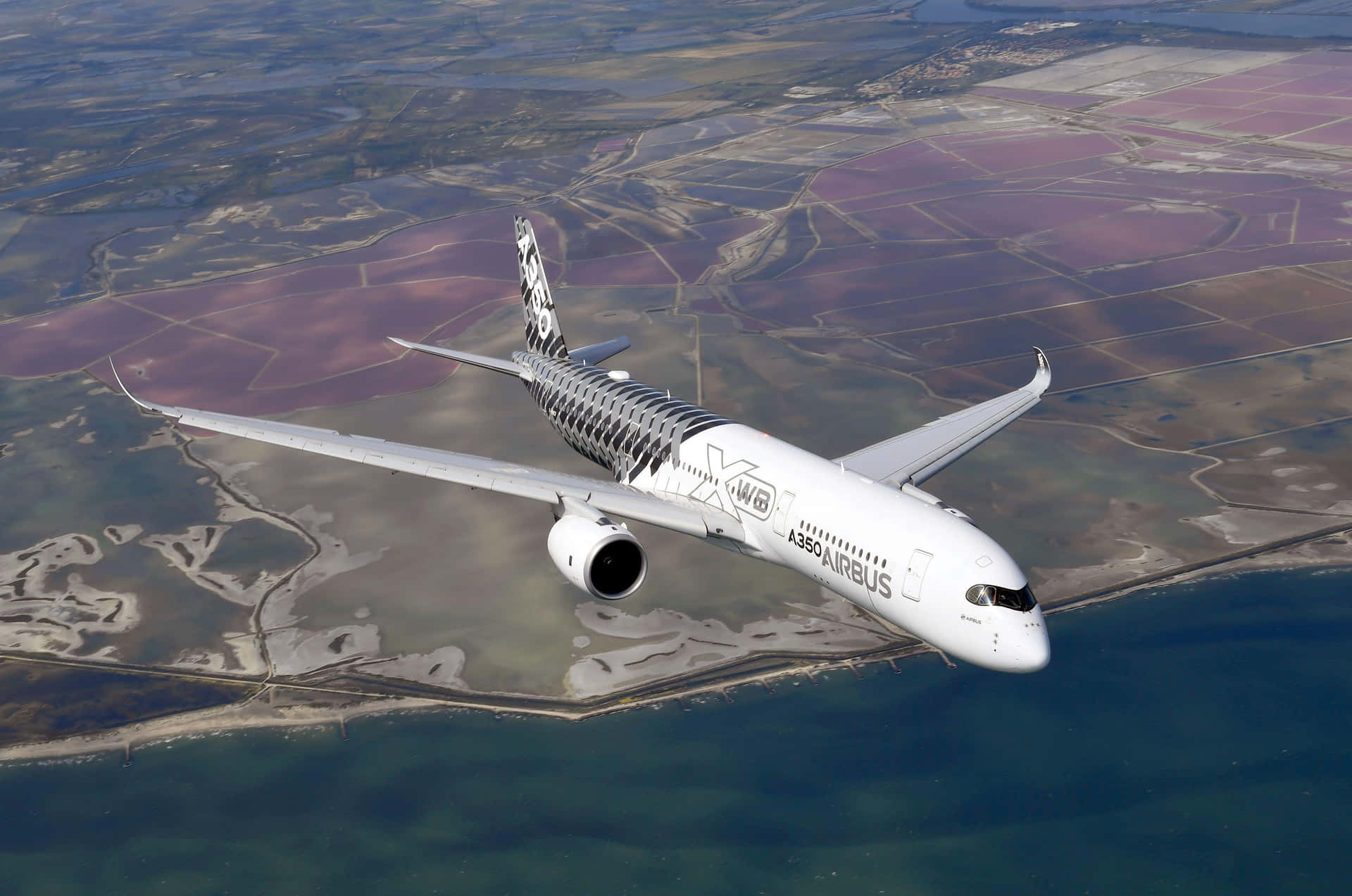 Airbus A350 Over Coastal Landscape Wallpaper