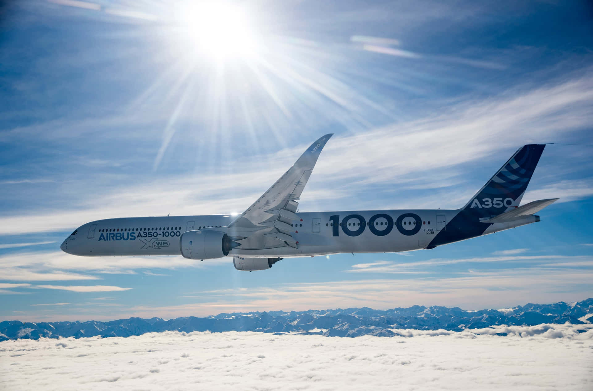 Airbus A3501000 Midflight Over Mountains Wallpaper