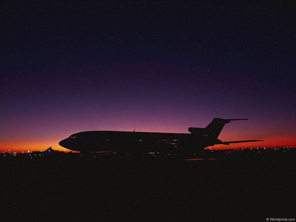 Airplane At Sunset