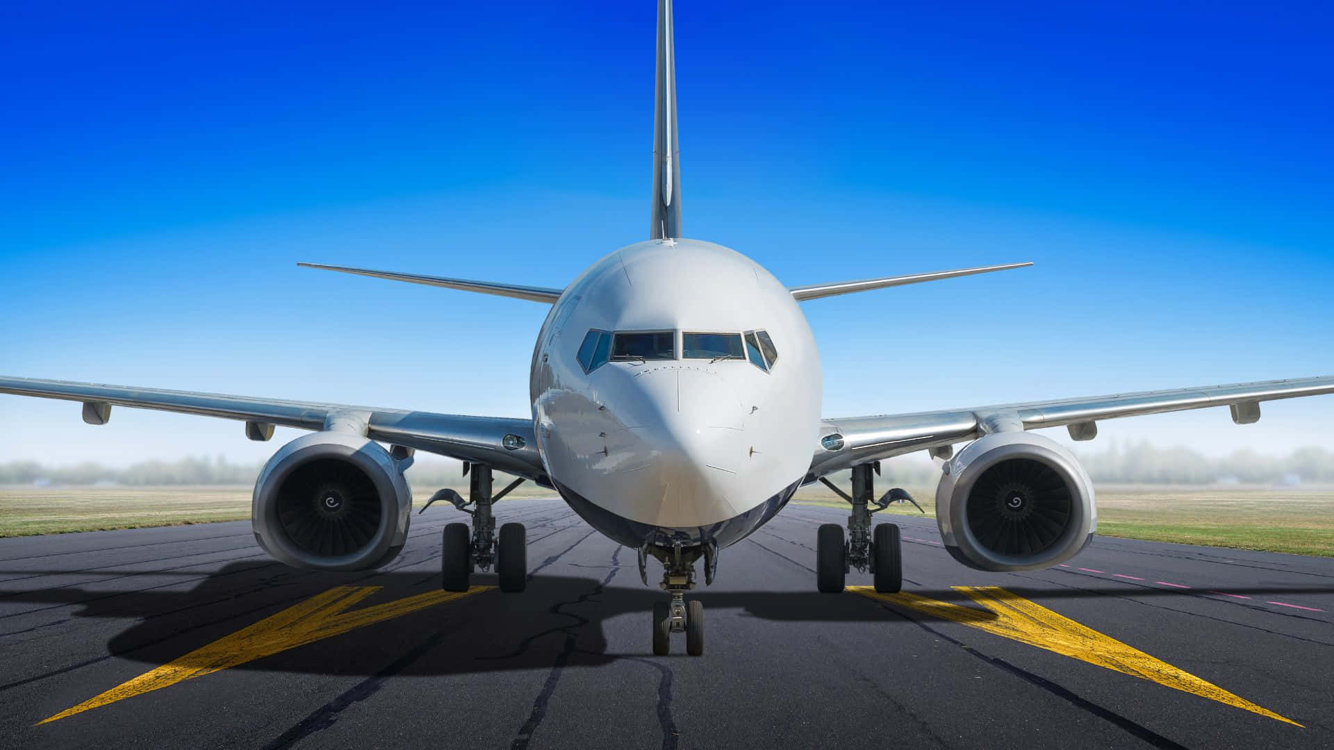 Airplane In Paved Runway Background