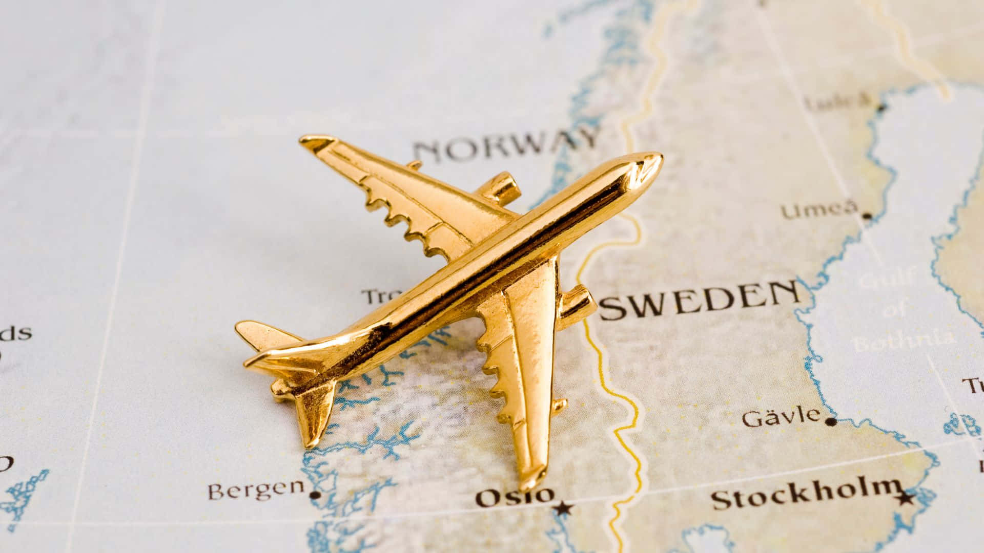 Golden Airplane On Map Background