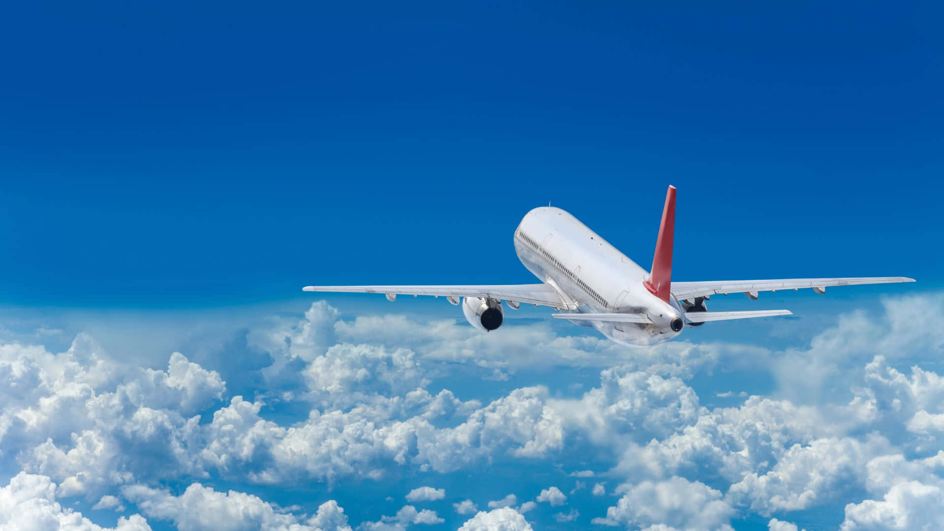 Airplane In The Blue Sky Background