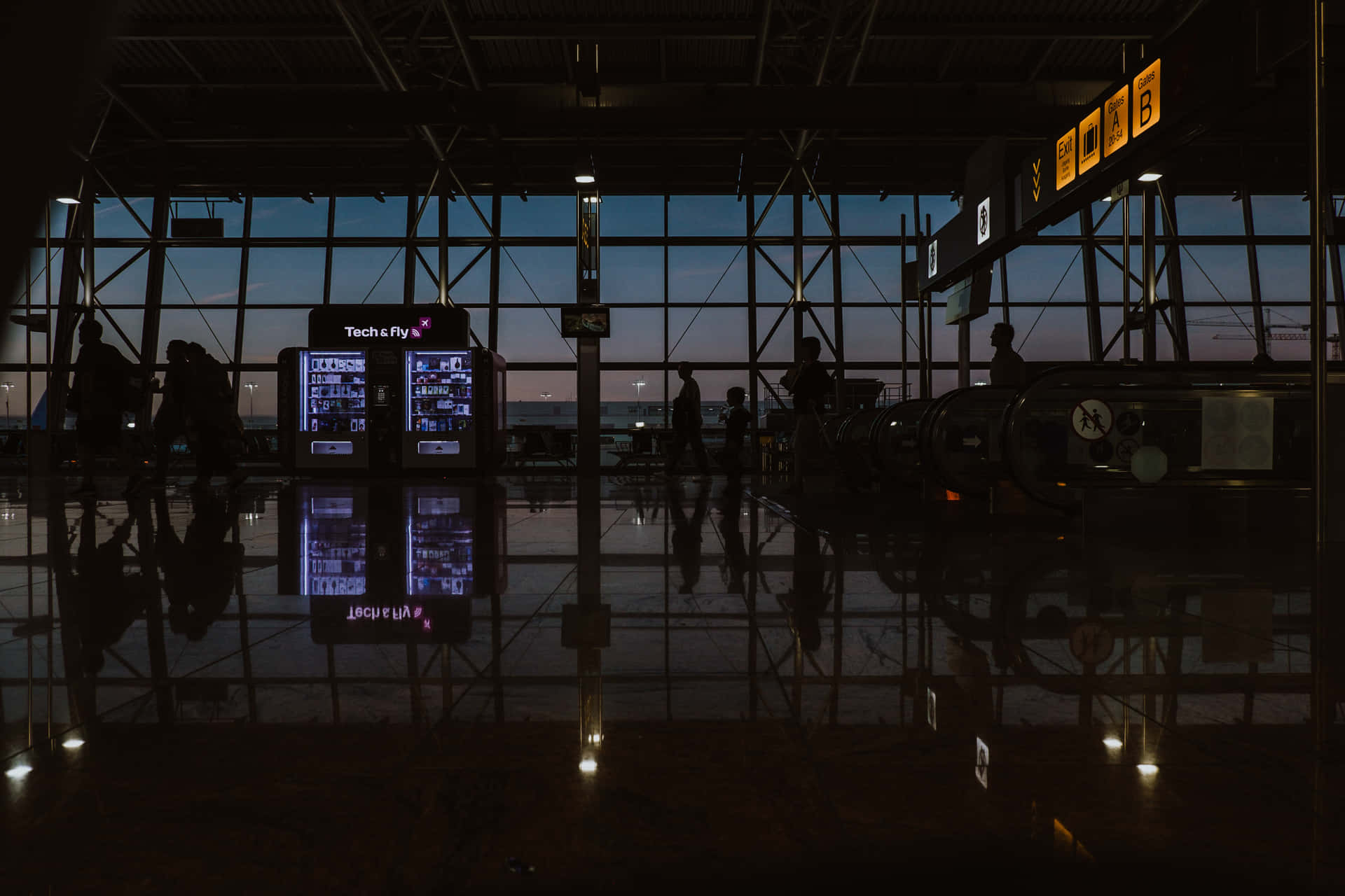 Travelers filing through Schiphol international airport