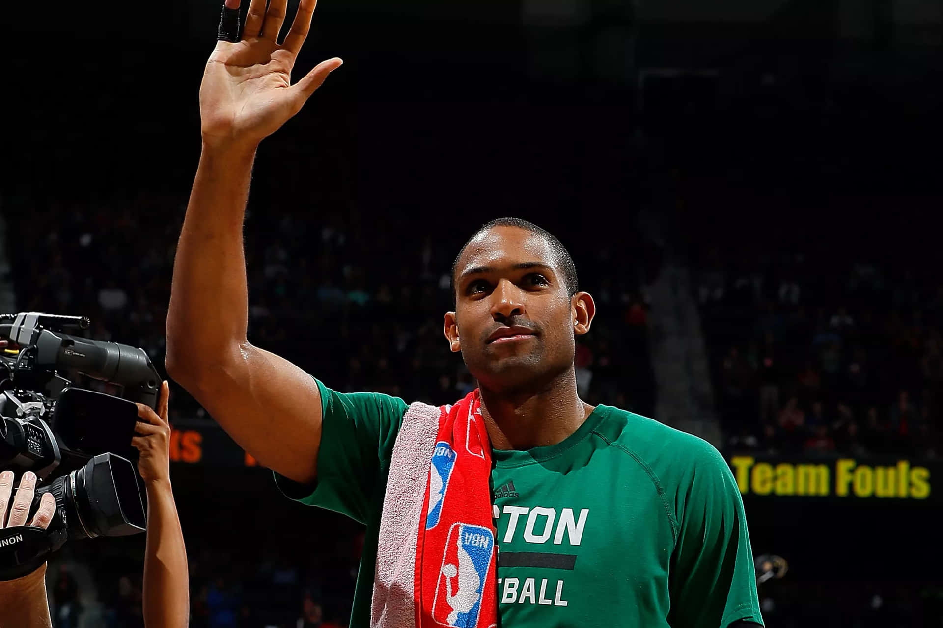 Al Horford holds up an NBA basketball
