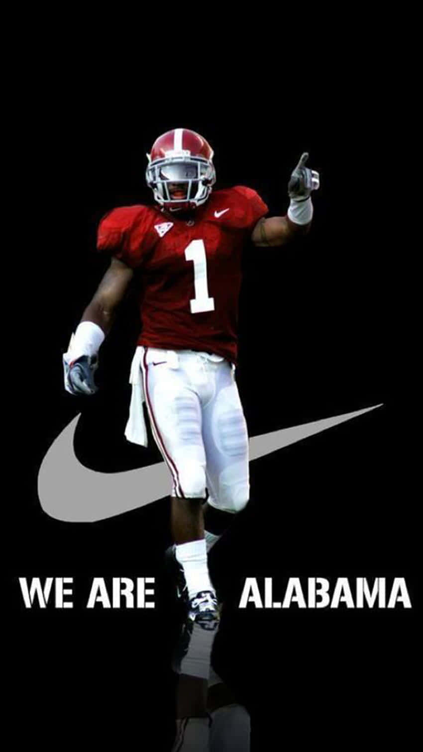 A Football Player With The Words We Are Alabama Wallpaper