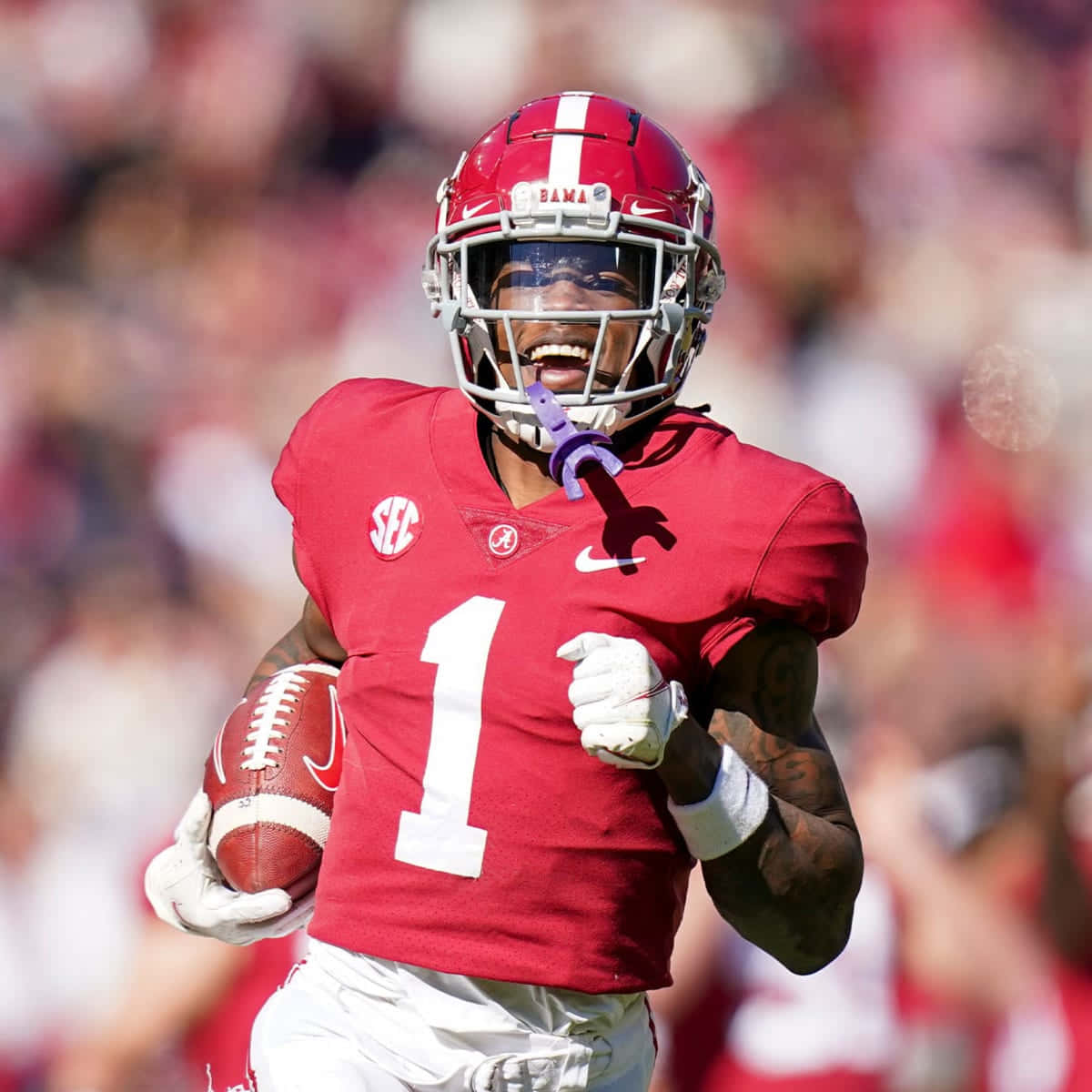 Alabama Football Player Running With Ball Wallpaper