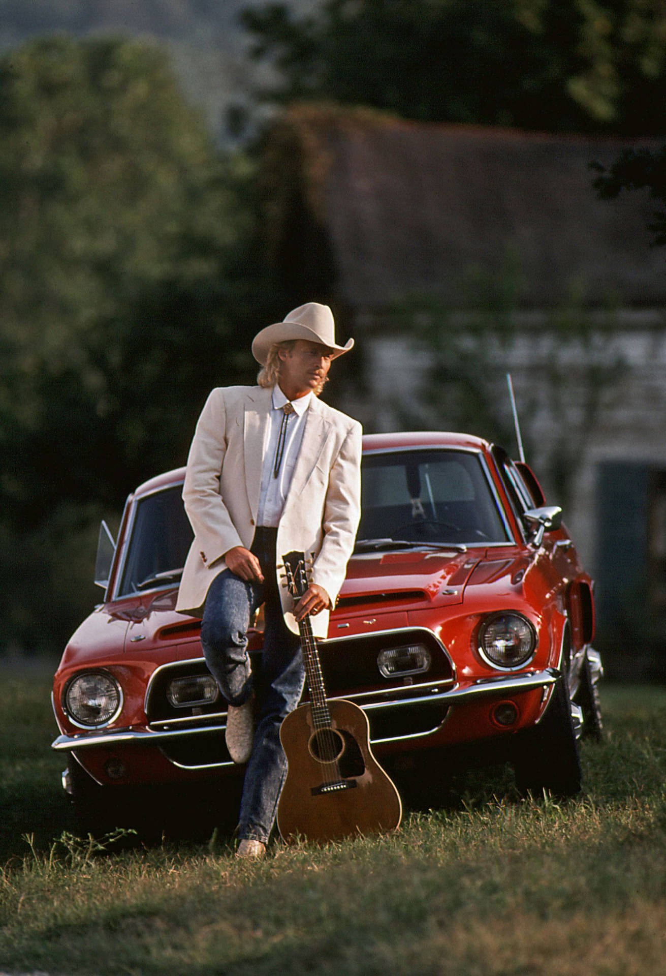 Alan Jackson Leaning Against Red Car Wallpaper