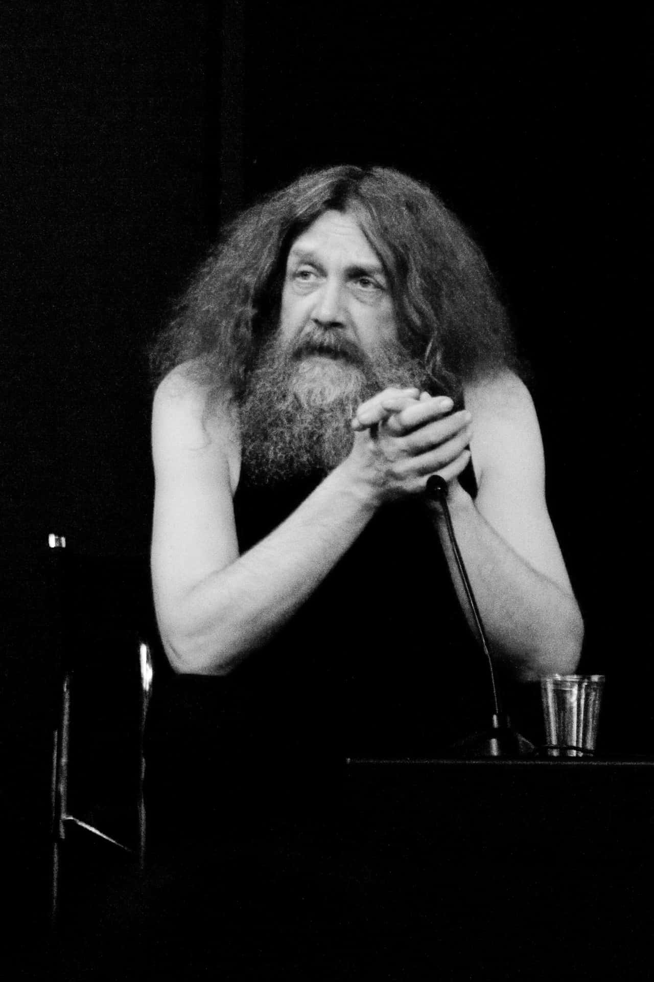 Renowned author Alan Moore in a contemplative pose Wallpaper