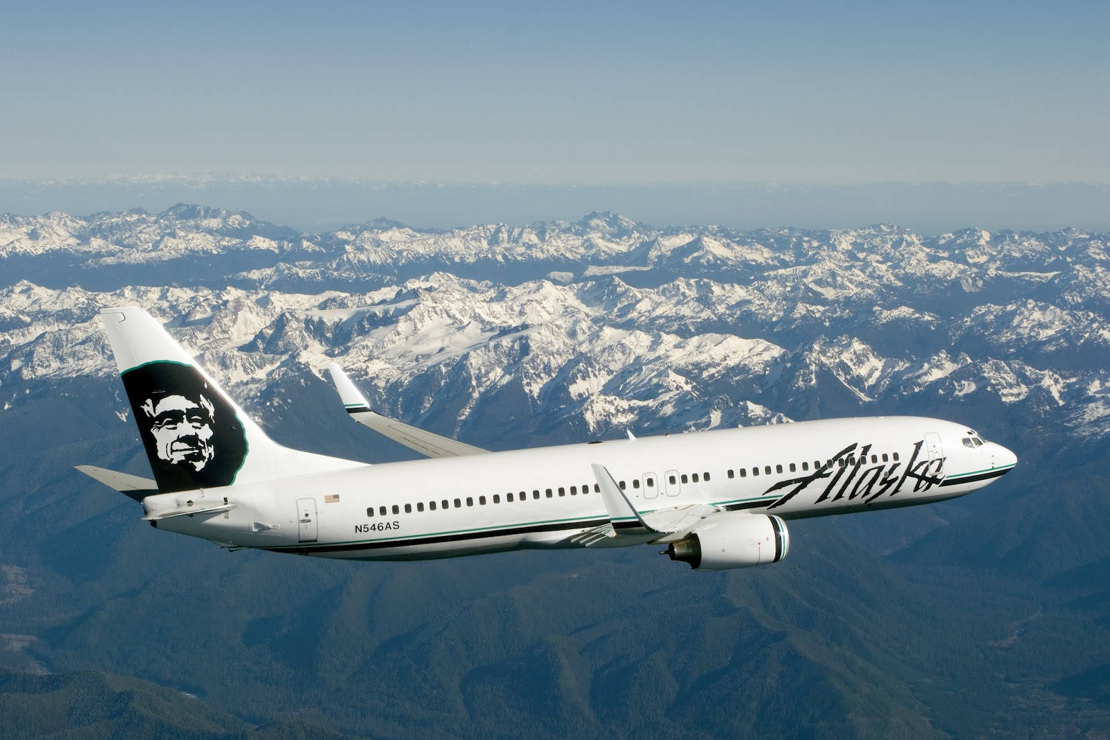 Alaska Airlines Flying Above The Alps Wallpaper