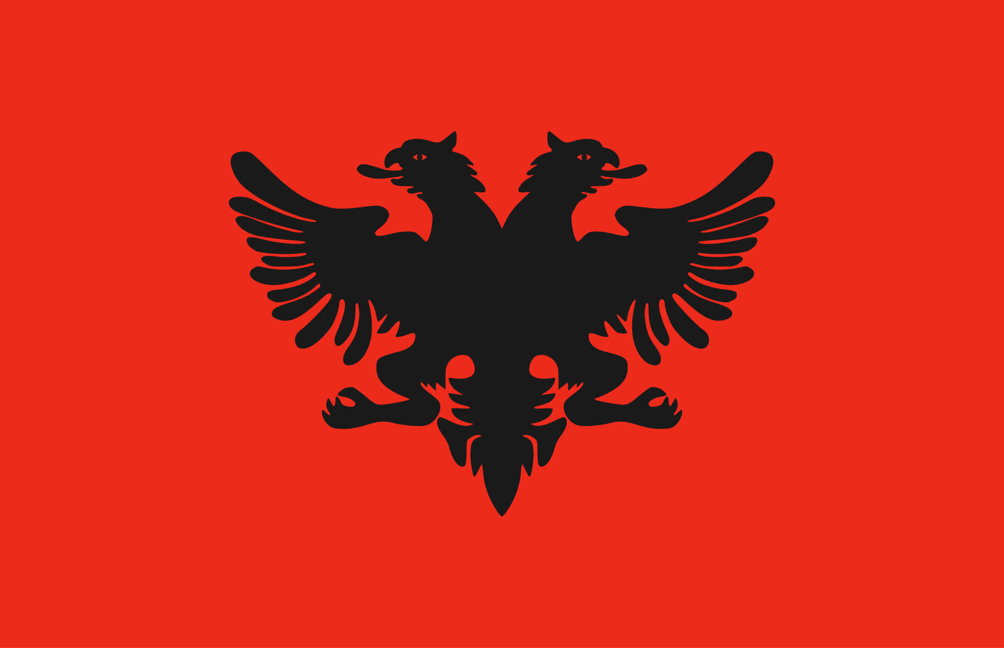 The Albanian Flag With Two Eagles On A Red Background