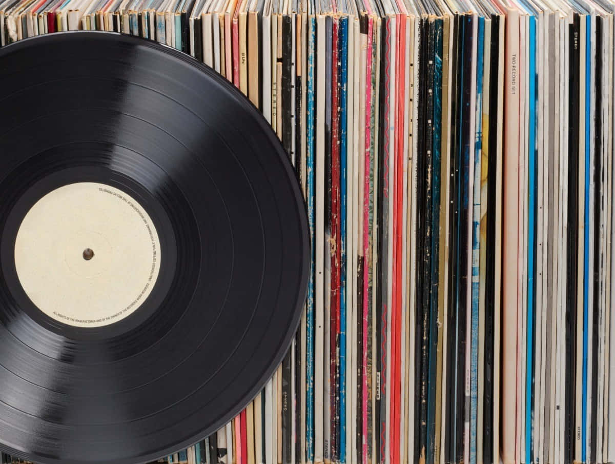 a record is sitting on top of a stack of records
