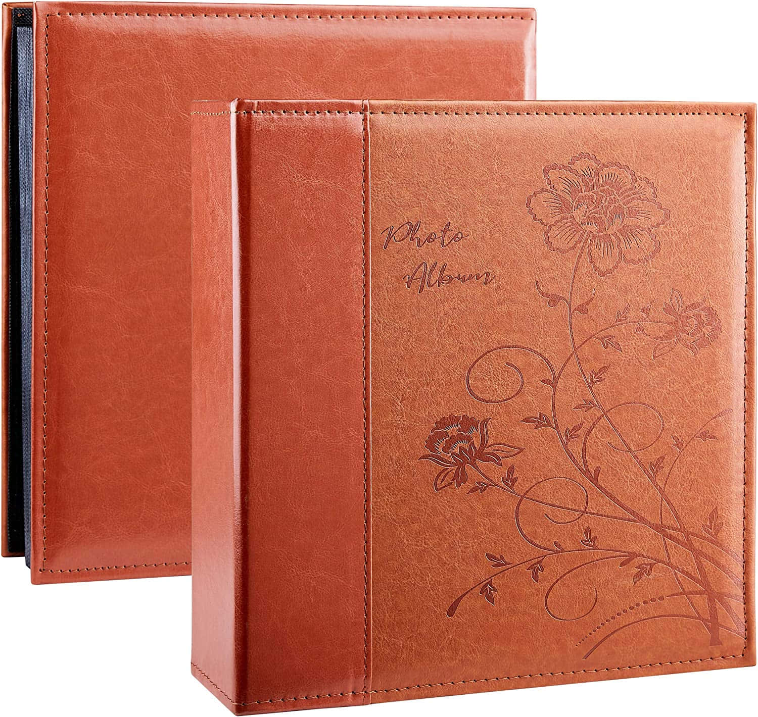 a brown leather photo album with floral design