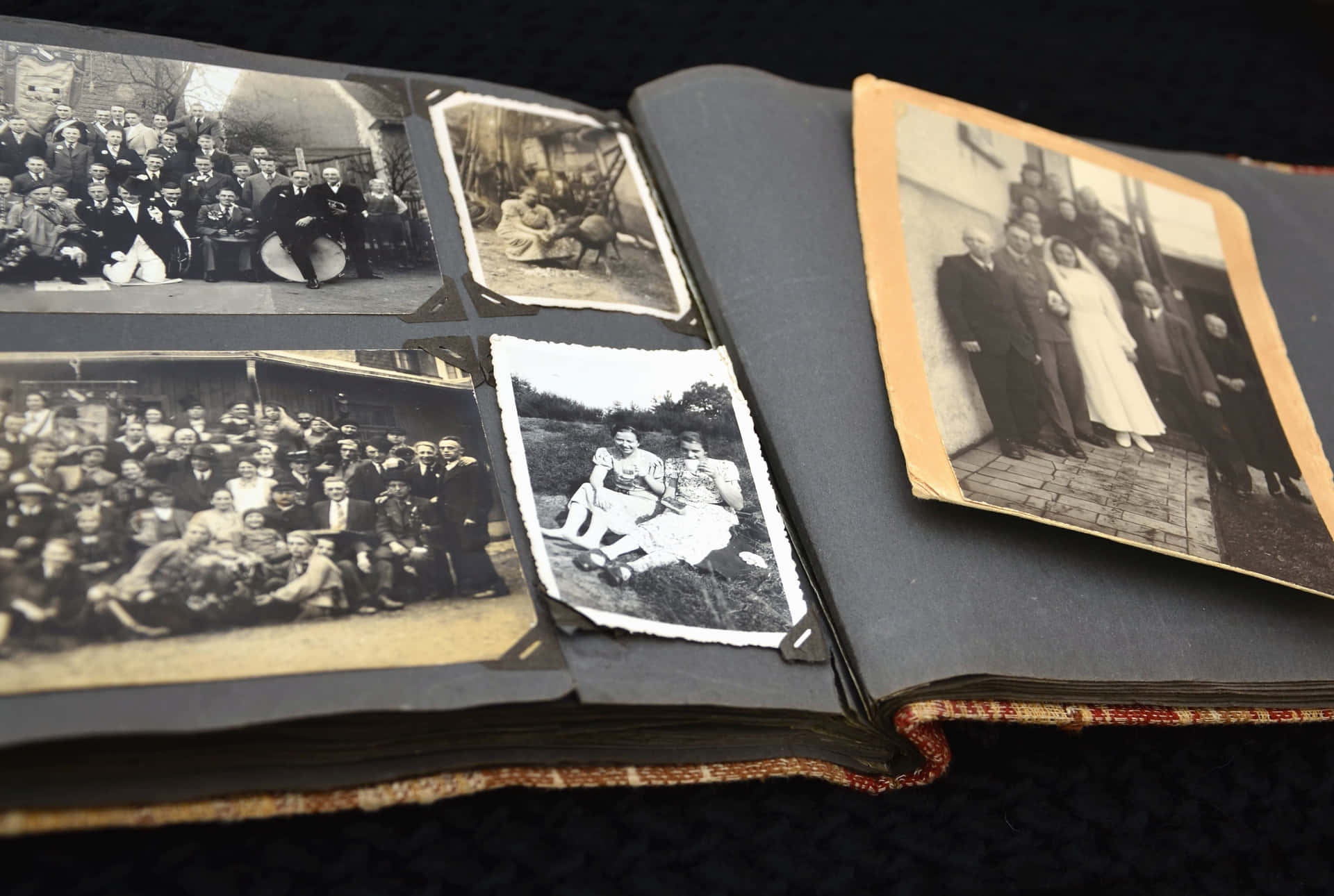 a book with old photos and a family photo