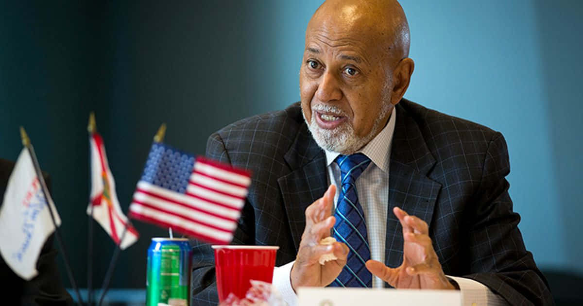 Caption: Renowned Congressman Alcee Hastings Flaunting a Blue Tie Wallpaper