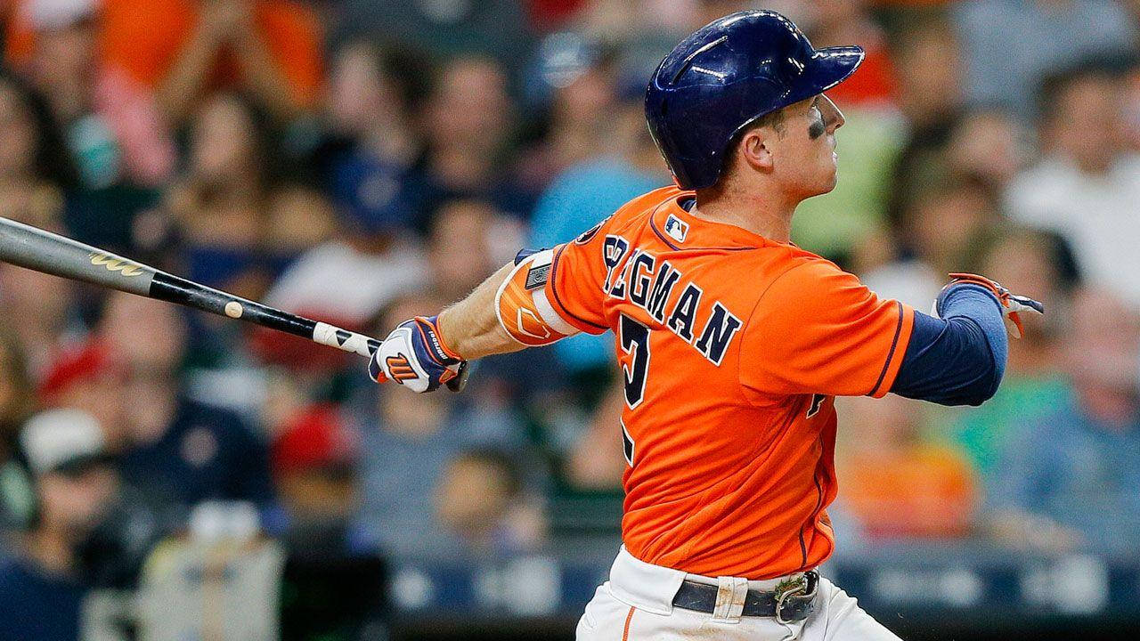 Alex Bregman In Orange Astros Uniform Swinging Bat