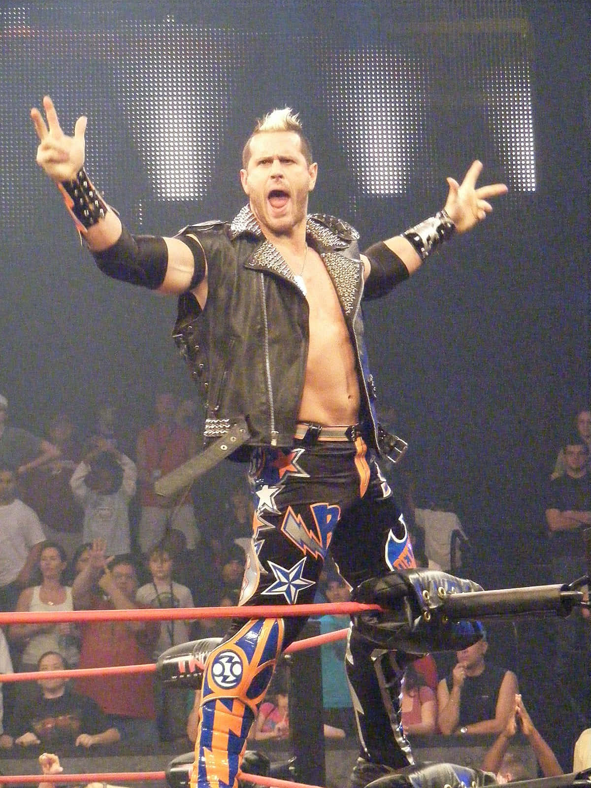Alex Shelley Posing On Top Of Ring During Entrance Wallpaper