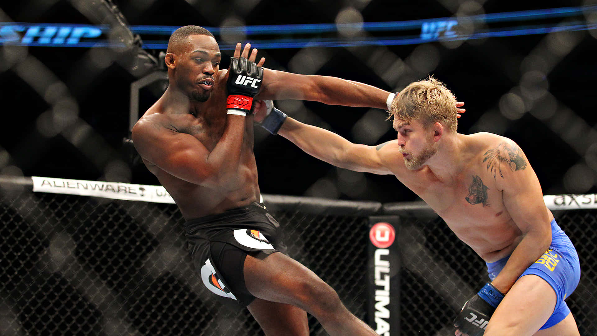Alexander Gustafsson Delivering Powerful Punch to Jon Jones in UFC Bout Wallpaper