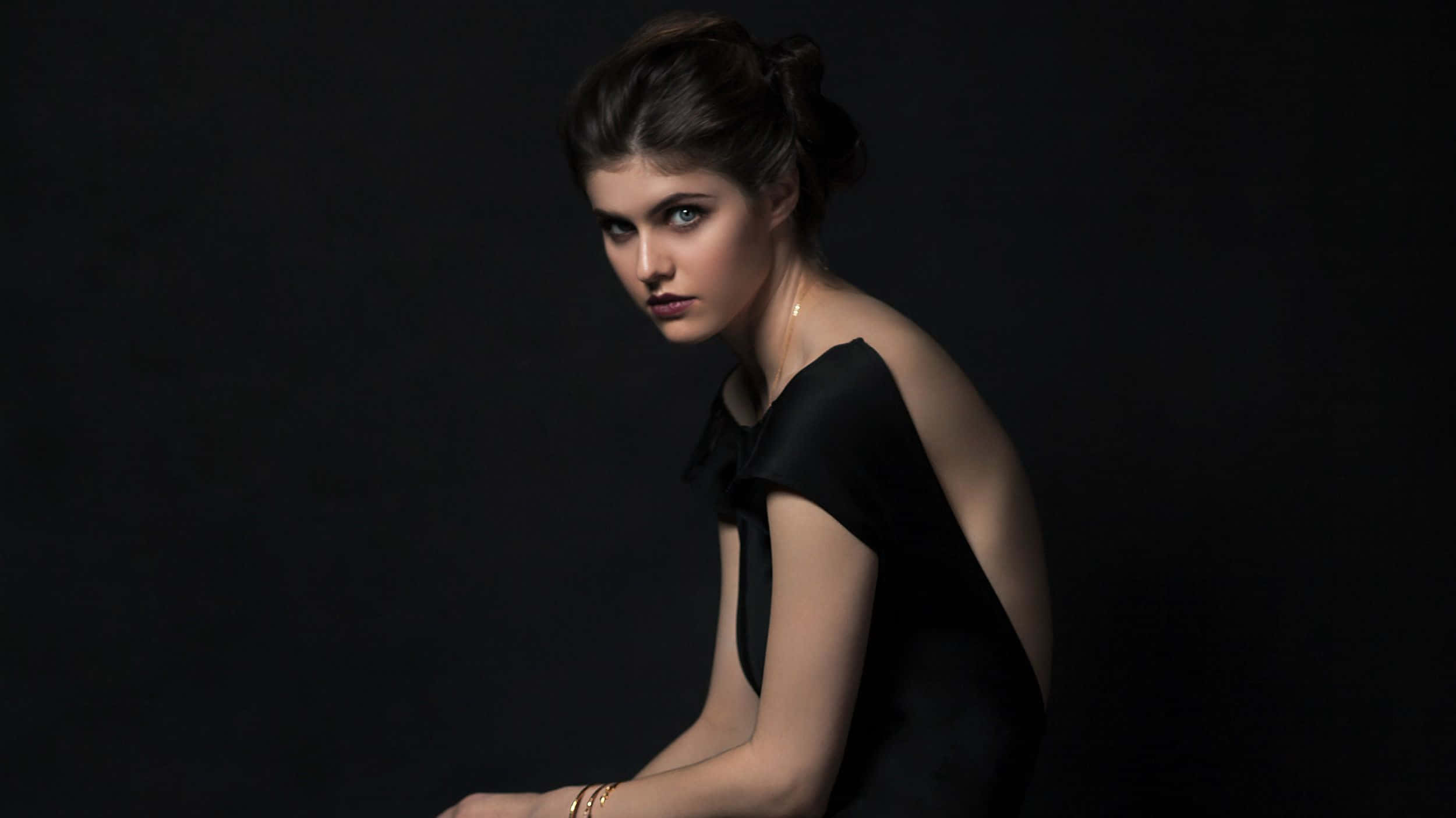 Caption: Stunning Alexandra Daddario posing in a captivating photoshoot