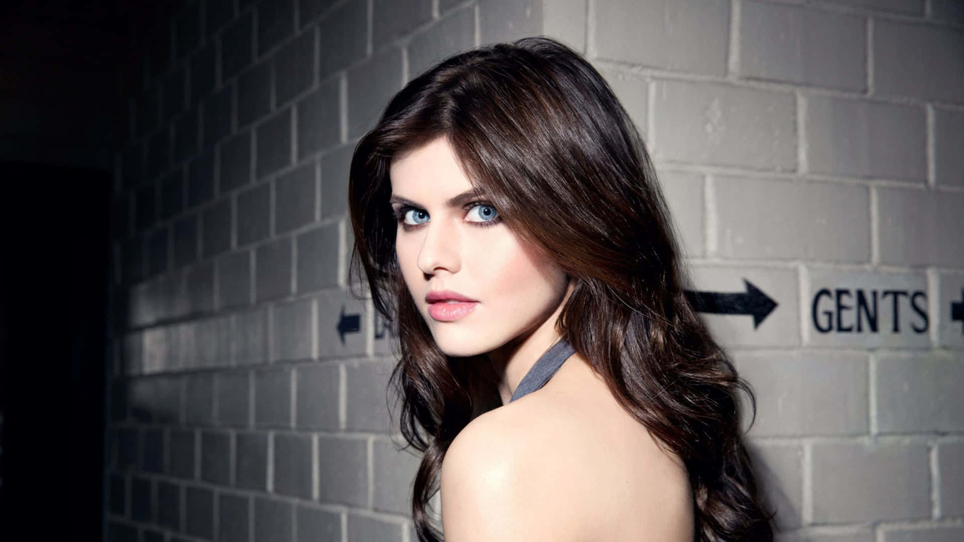 Alexandra Daddario striking a pose in a stunning outfit