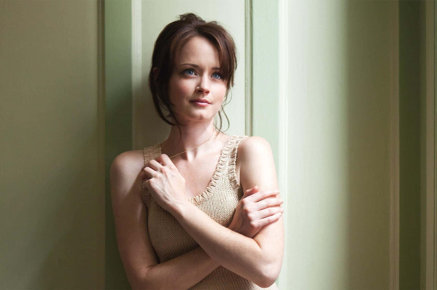 Alexis Bledel striking a pose during a photoshoot. Wallpaper