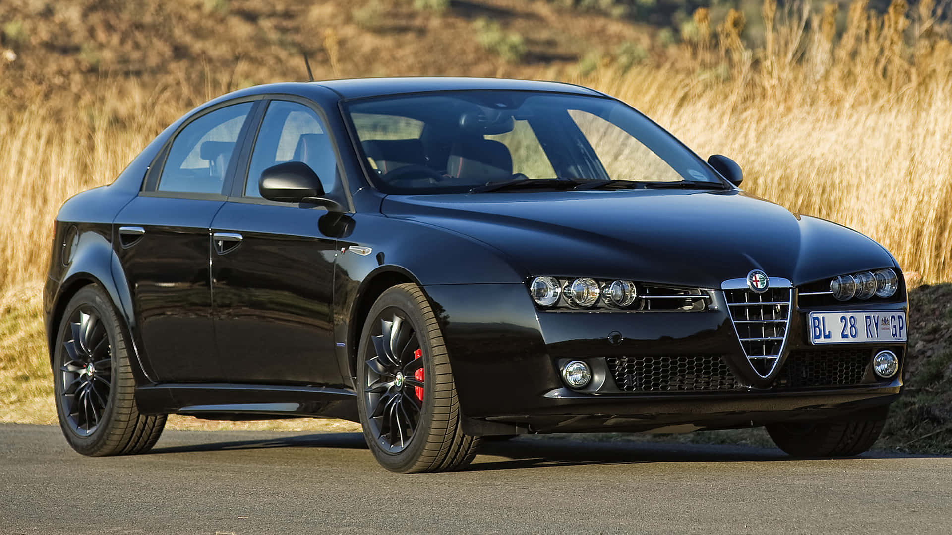 Stunning Alfa Romeo 159 in Full Glory Wallpaper