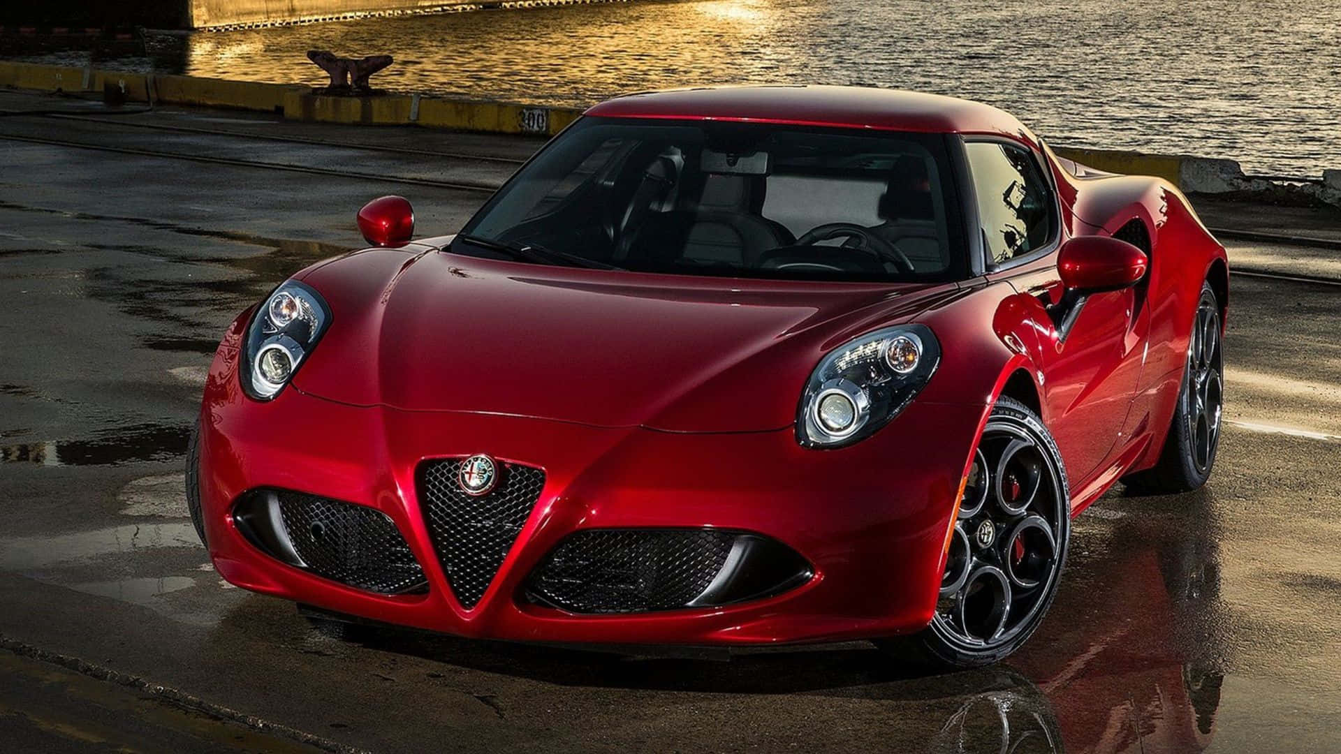 Sleek Alfa Romeo 4C sports car in motion Wallpaper