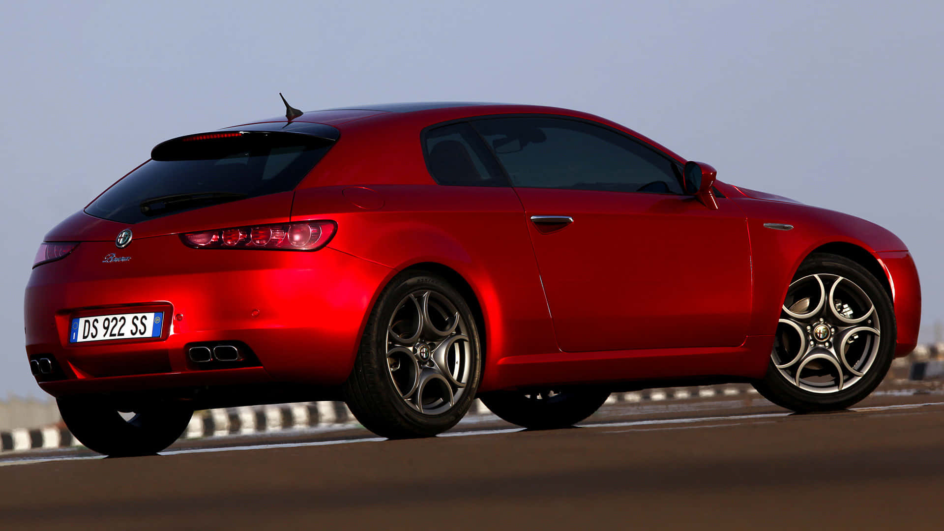 Sleek Alfa Romeo Brera in a stunning outdoor setting Wallpaper