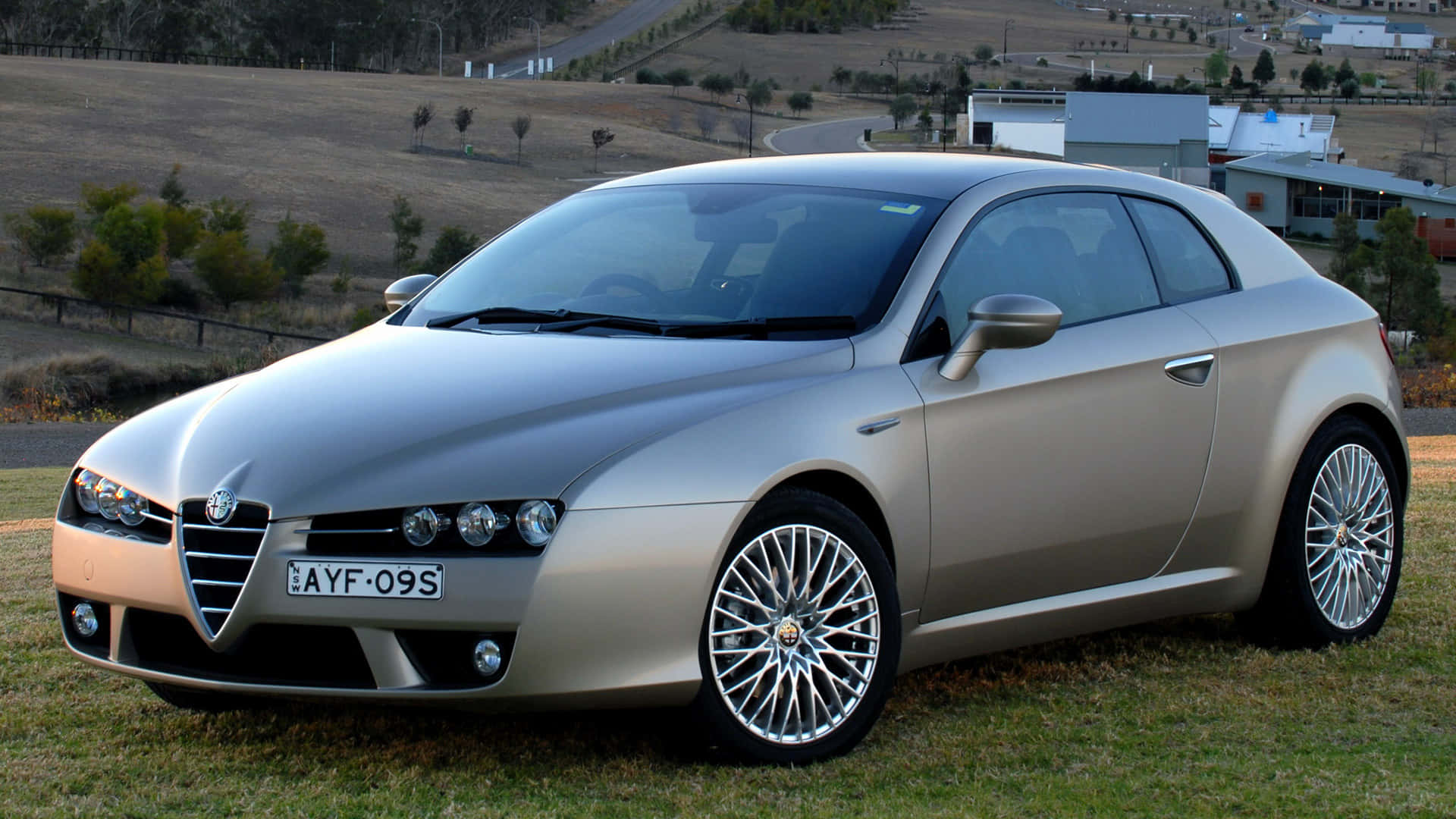 Sleek Alfa Romeo Brera in a Majestic Landscape Wallpaper