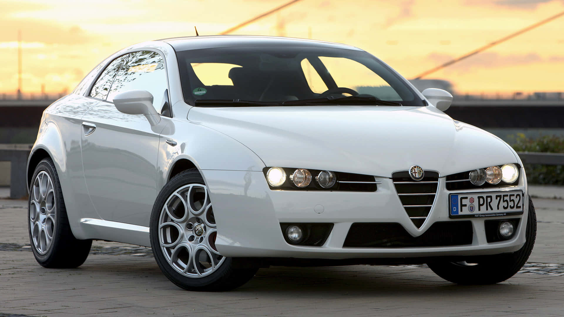 Sleek Alfa Romeo Brera on a scenic backdrop Wallpaper