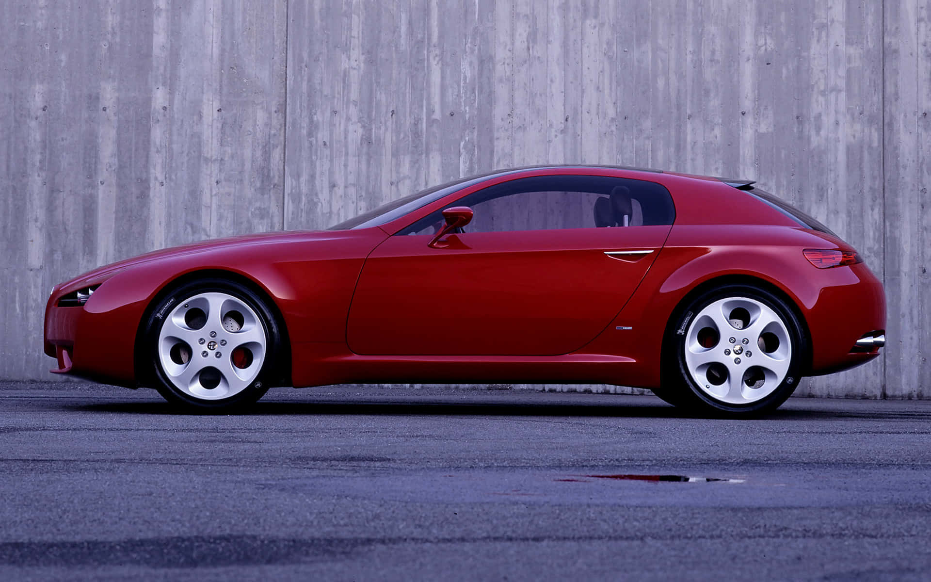 Sleek Red Alfa Romeo Brera in Action Wallpaper