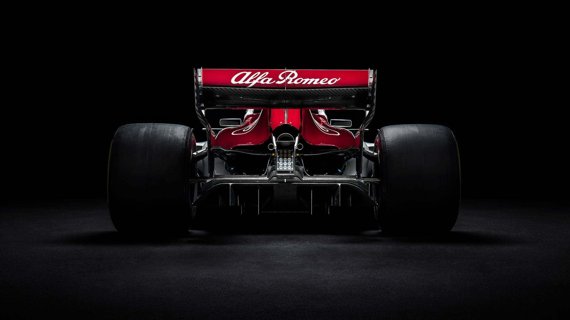 Alfa Romeo Formula One racing car rear view black wallpaper.
