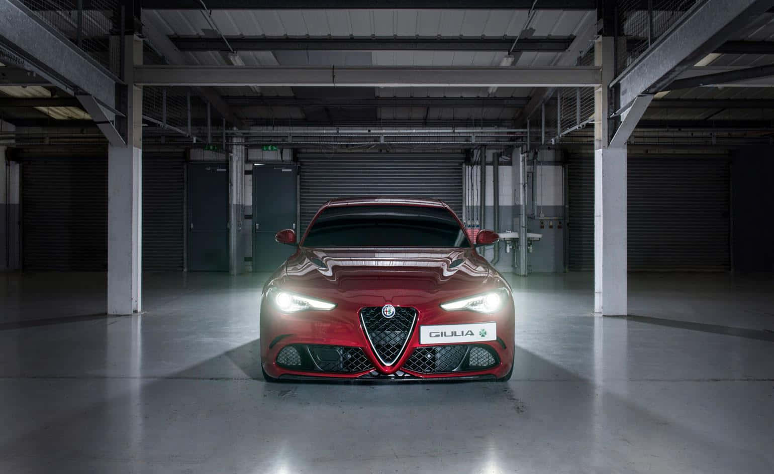 Exquisite Alfa Romeo Giulia on an open road Wallpaper