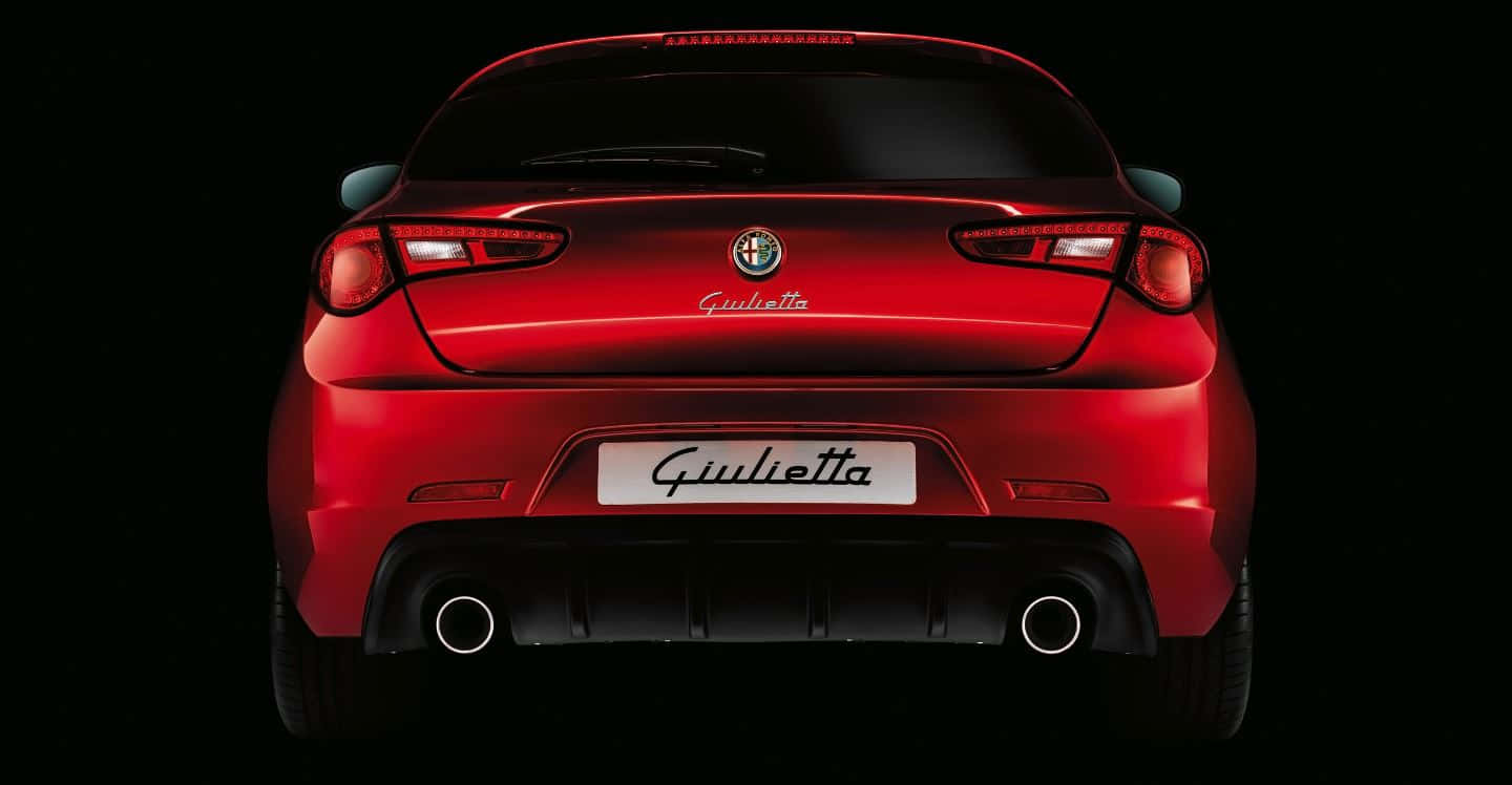 Sleek Alfa Romeo Giulietta on the Open Road Wallpaper