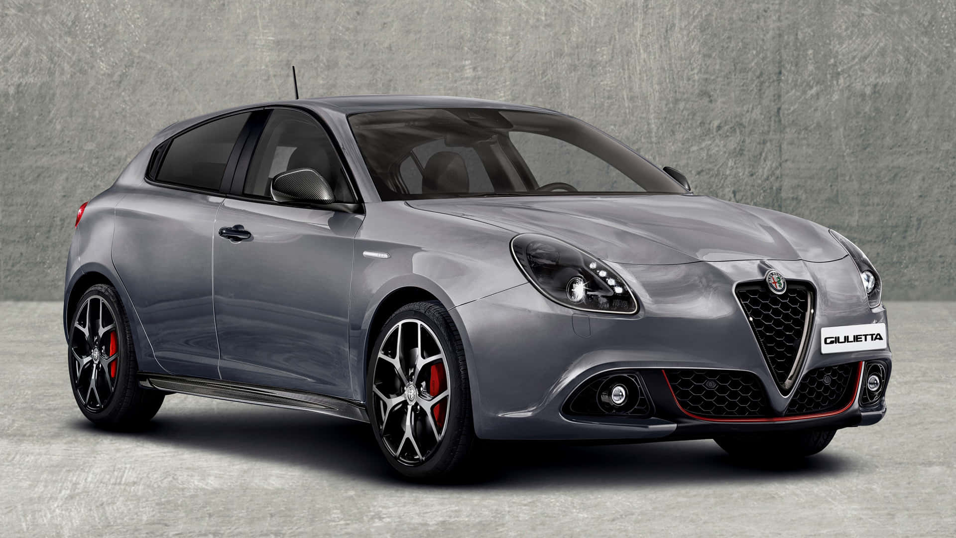 Sleek Alfa Romeo Giulietta on Scenic Road Wallpaper