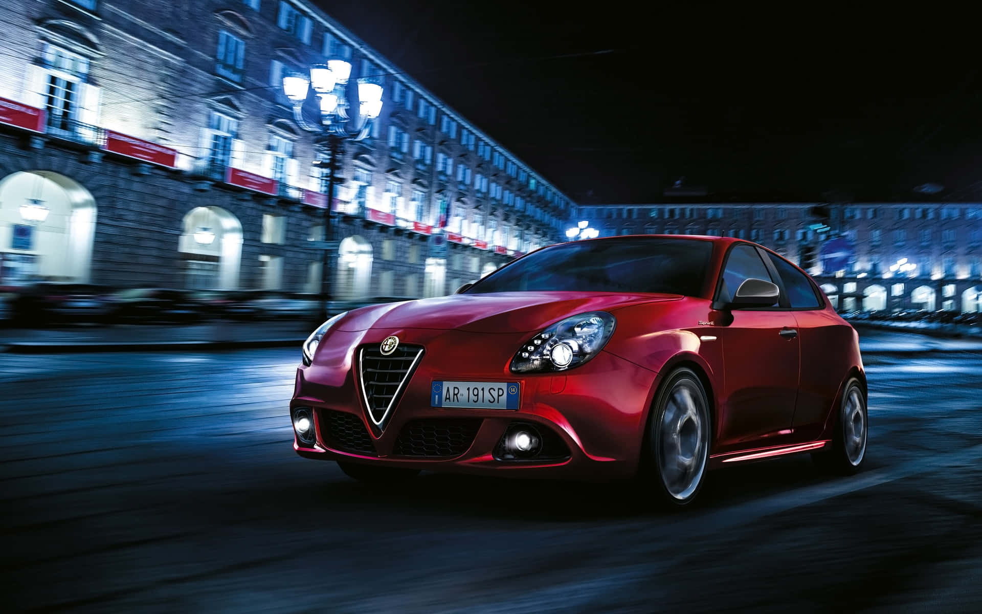 Sleek and Stylish Alfa Romeo Giulietta in Action Wallpaper