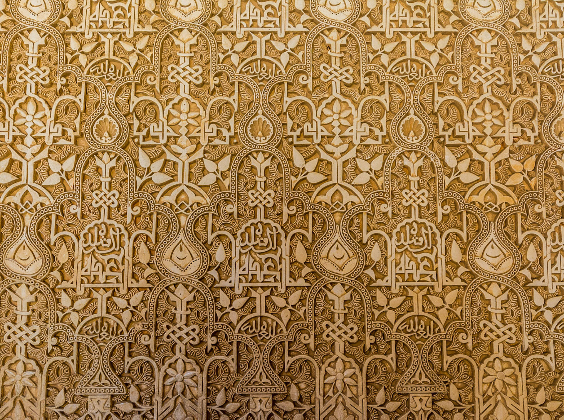 Majestic Detail of Alhambra's Ornate Wall Wallpaper
