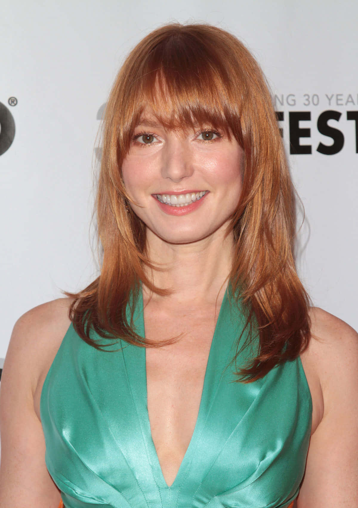 Alicia Witt striking a pose in a stunning outfit Wallpaper