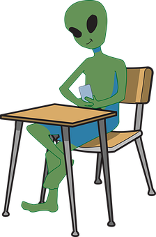 Alien Studyingat Desk PNG