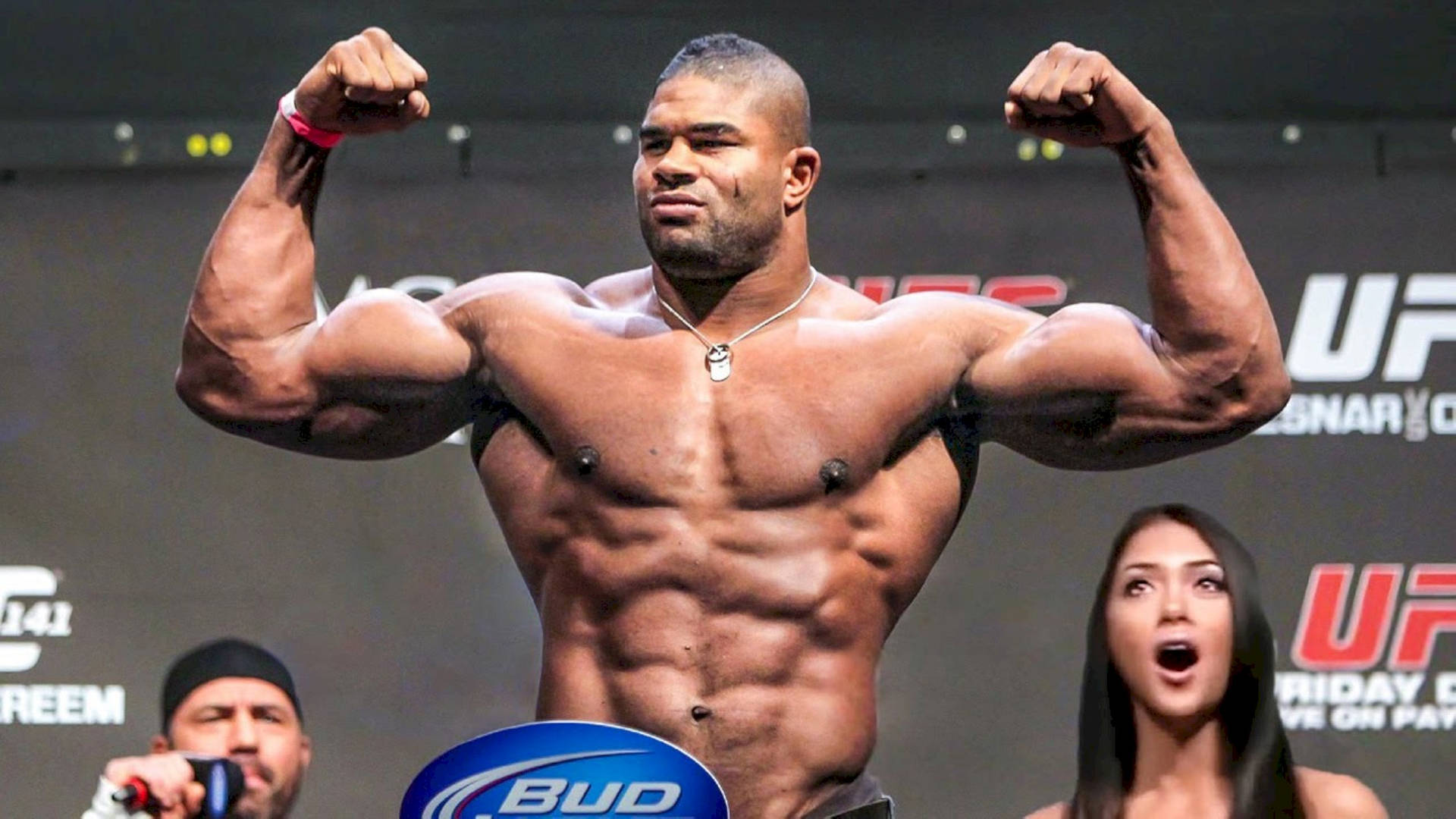 Alistair Overeem, showing off his biceps with a powerful flex. Wallpaper