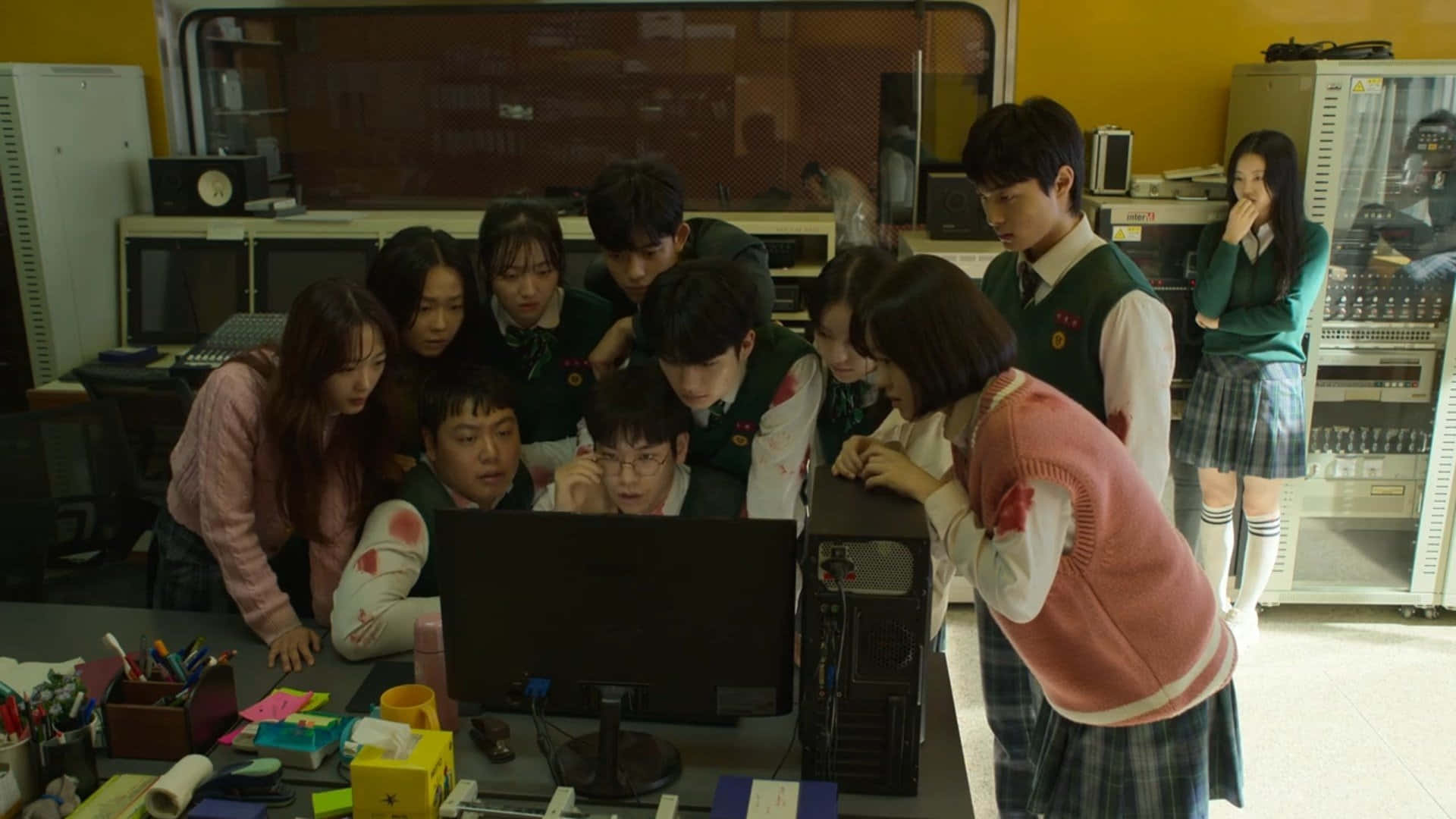 A Group Of School Students Looking At A Computer