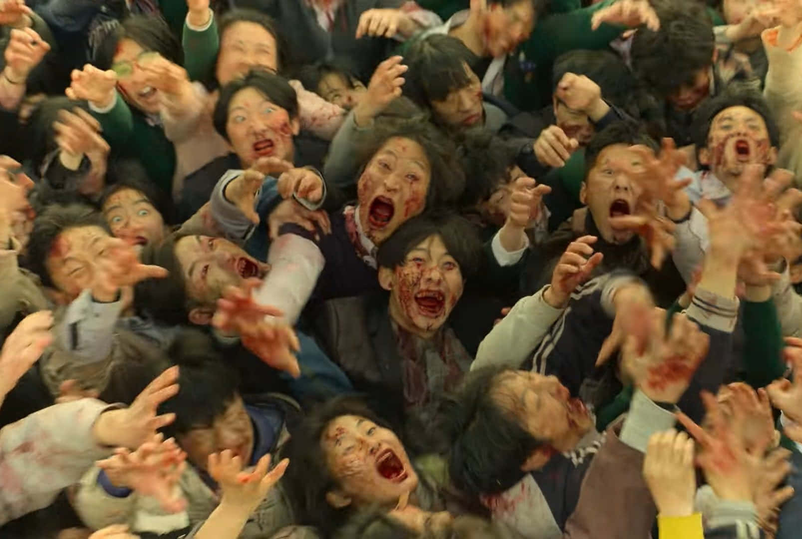 A Group Of People With Blood On Their Faces