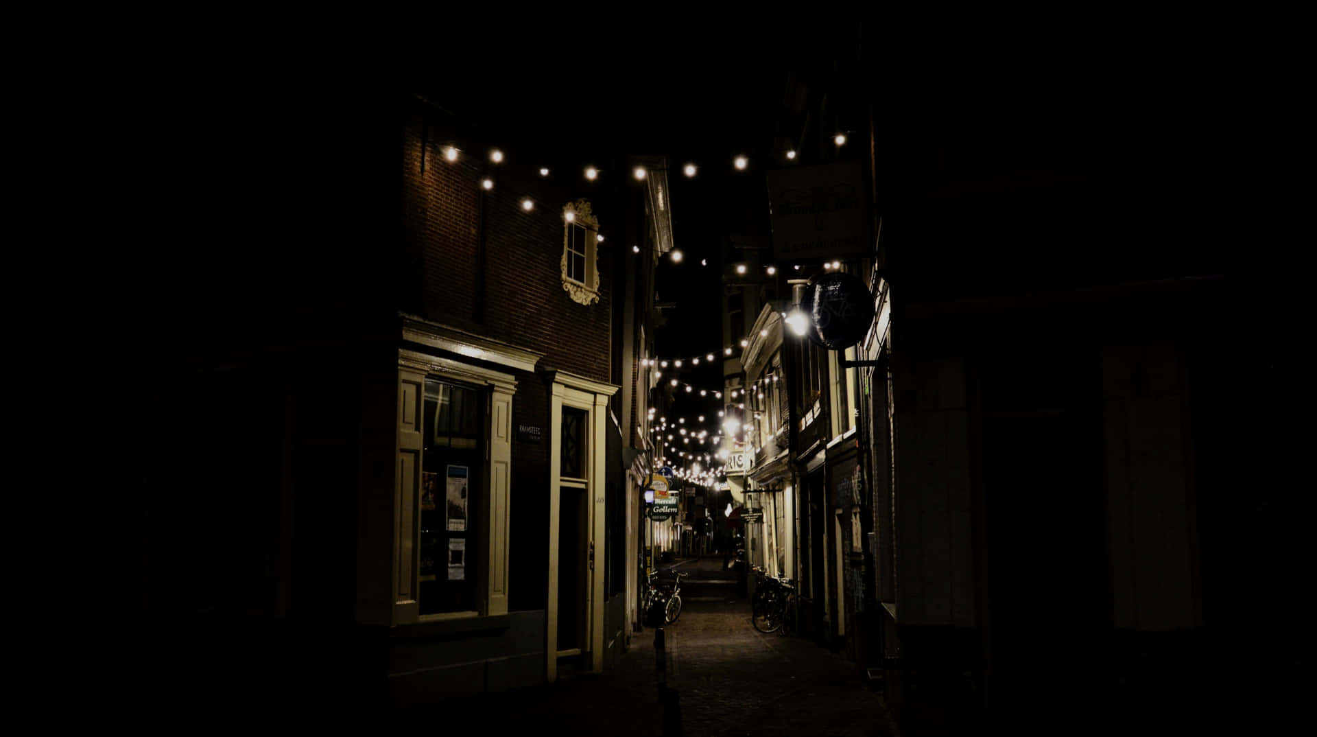 Alley With String Of Light Bulbs Background