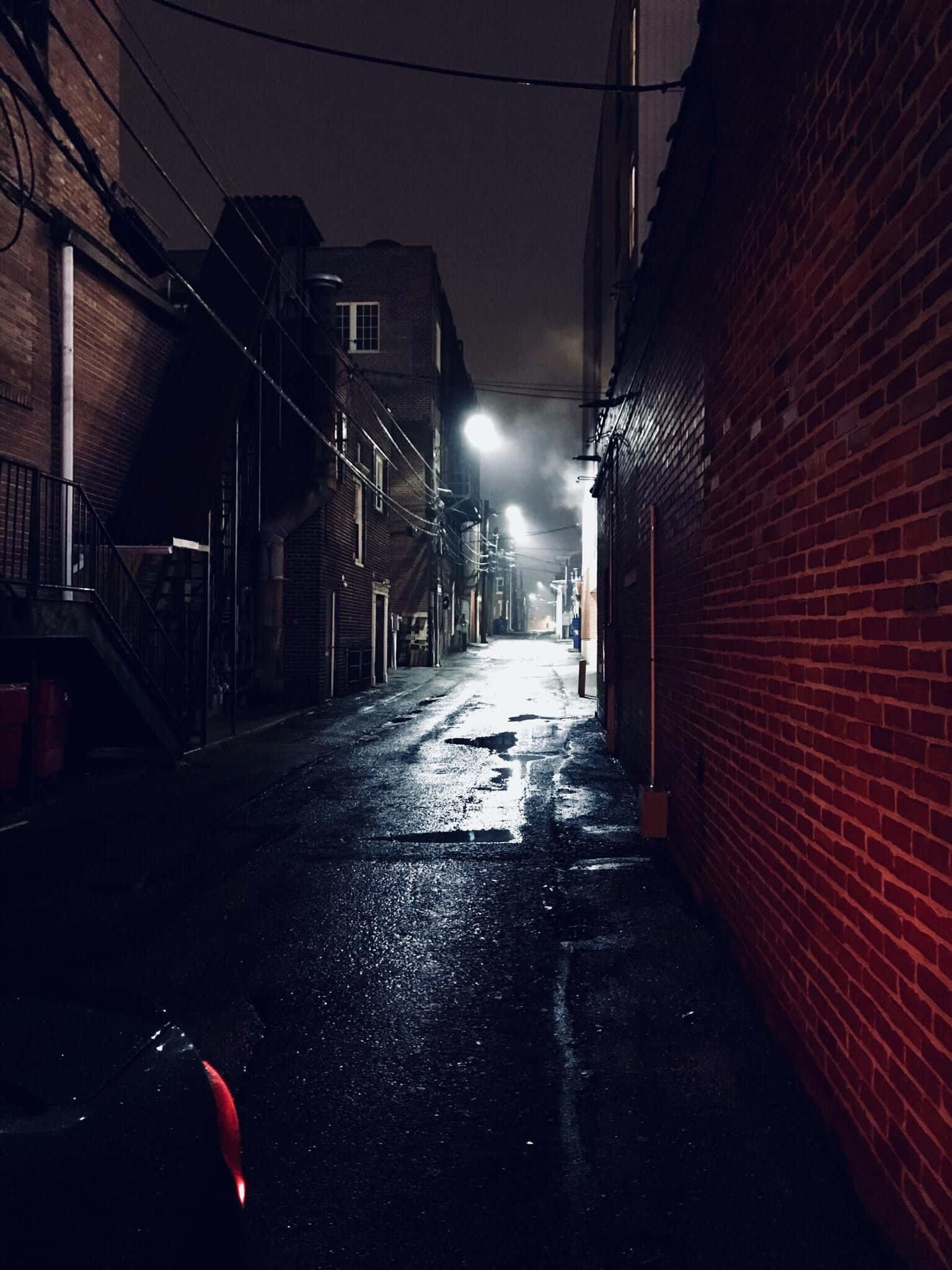 A Dark Alley With A Red Light