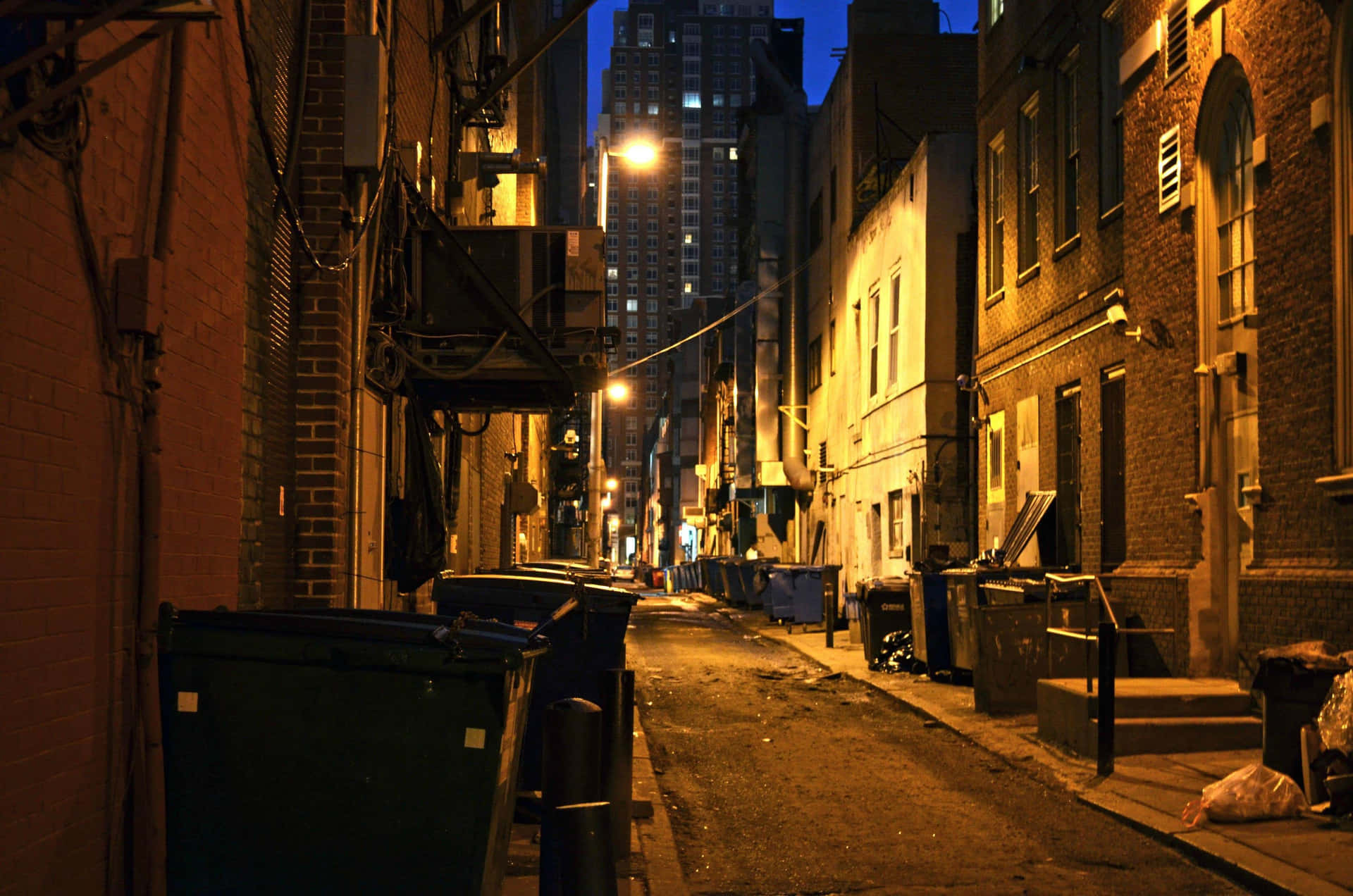 A Narrow Alleyway With A Trash Can